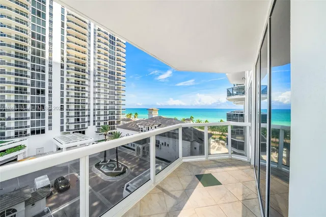 a view of a kitchen with a large window