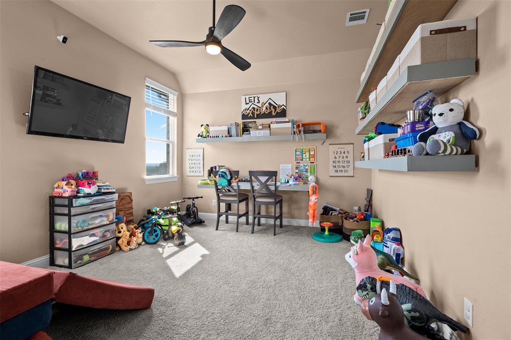 305 Monument Place Azle, TX 76020 - Photo 13 of 29 a living room with furniture and a flat screen tv