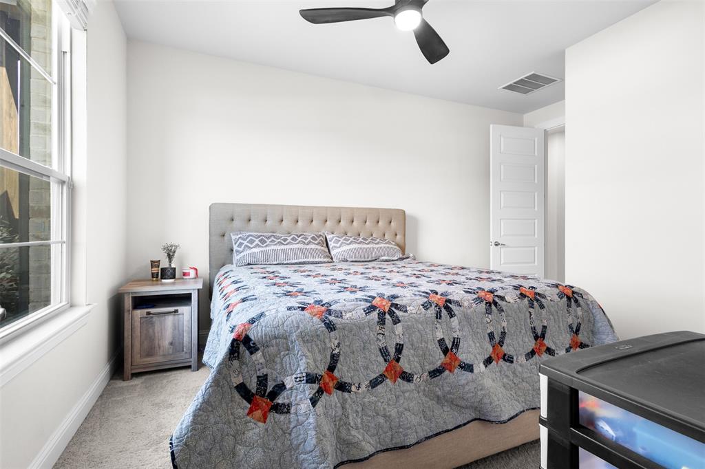 305 Monument Place Azle, TX 76020 - Photo 19 of 29 a bedroom with a bed and window