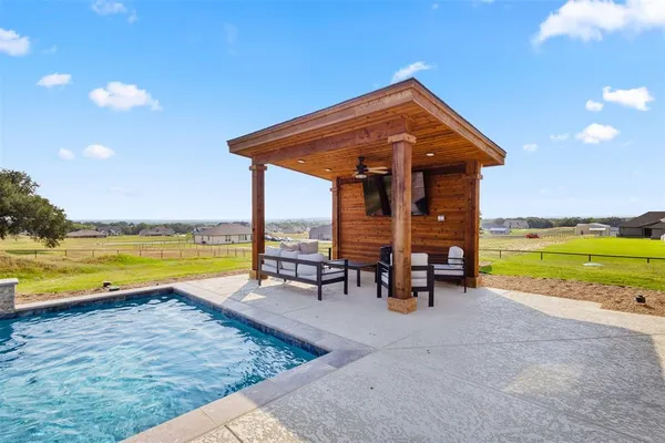 a view of a house with outdoor space and ocean view