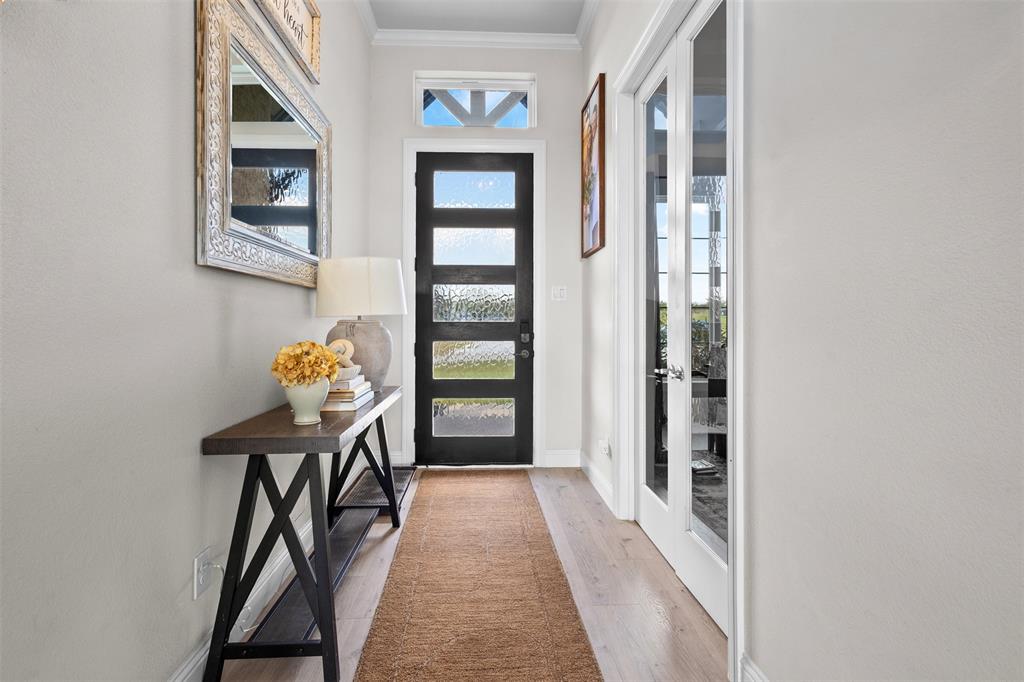 305 Monument Place Azle, TX 76020 - Photo 5 of 29 a view of a hallway to a livingroom with furniture