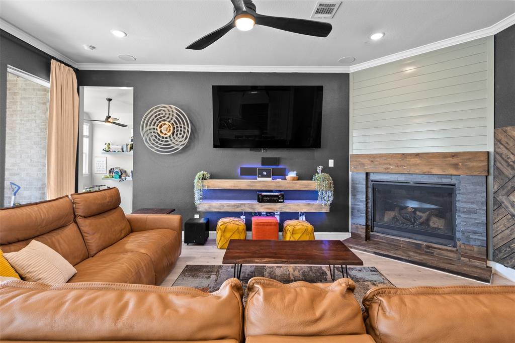 305 Monument Place Azle, TX 76020 - Photo 7 of 29 a living room with furniture and a fireplace