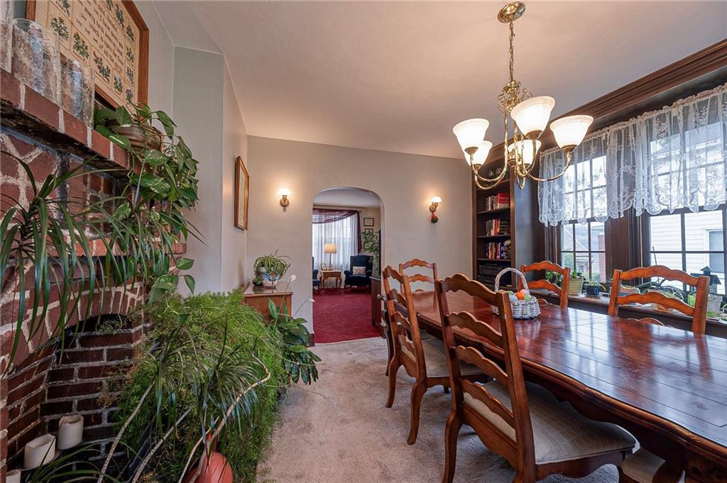 451 Walnut Street Pittsburgh, PA 15238 - Photo 11 of 40 a view of a dining room with furniture and chandelier