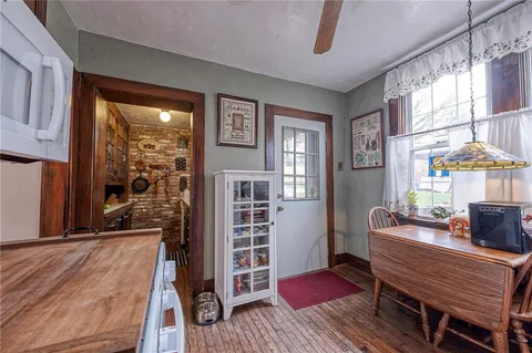 a bedroom with furniture and a window