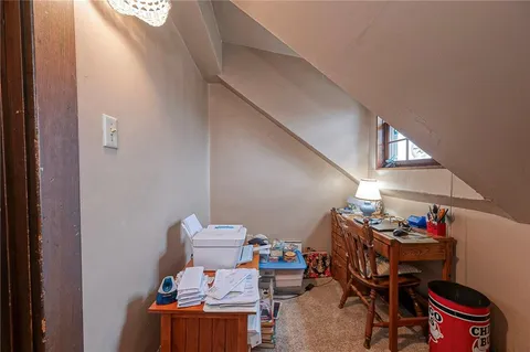 a bedroom with bed and window
