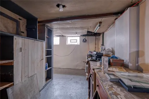 a bathroom with a sink toilet and window
