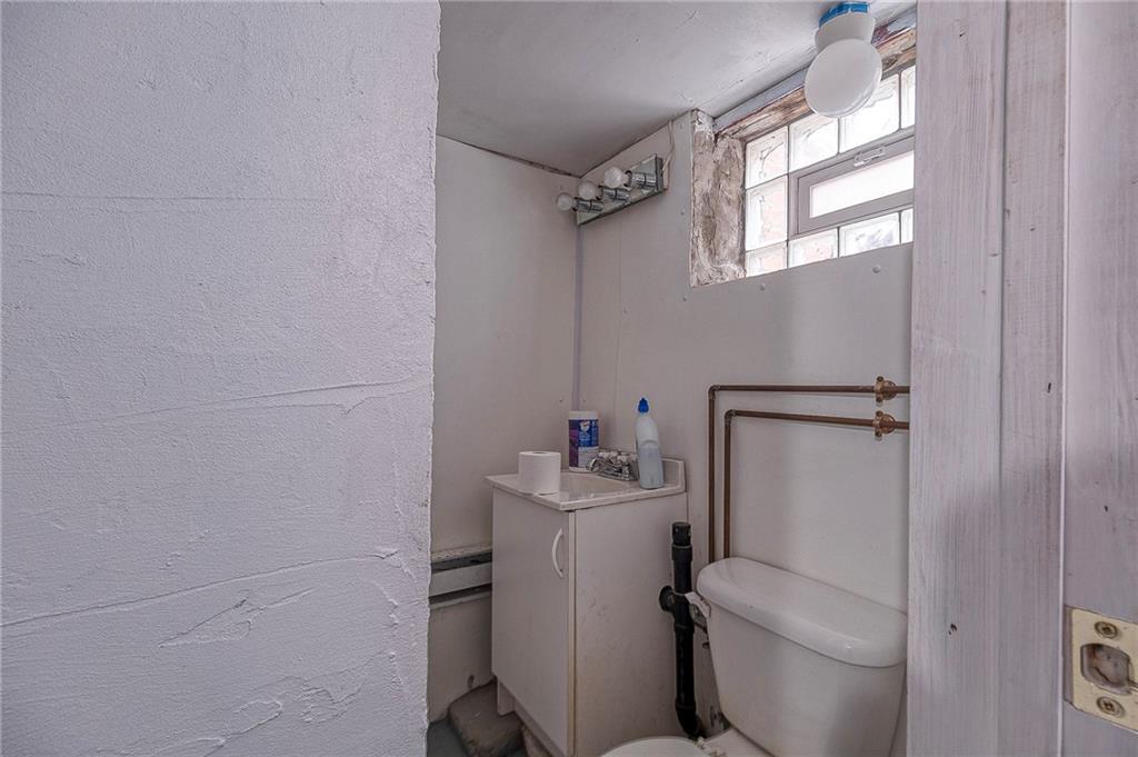 451 Walnut Street Pittsburgh, PA 15238 - Photo 28 of 40 a bathroom with a sink toilet and window