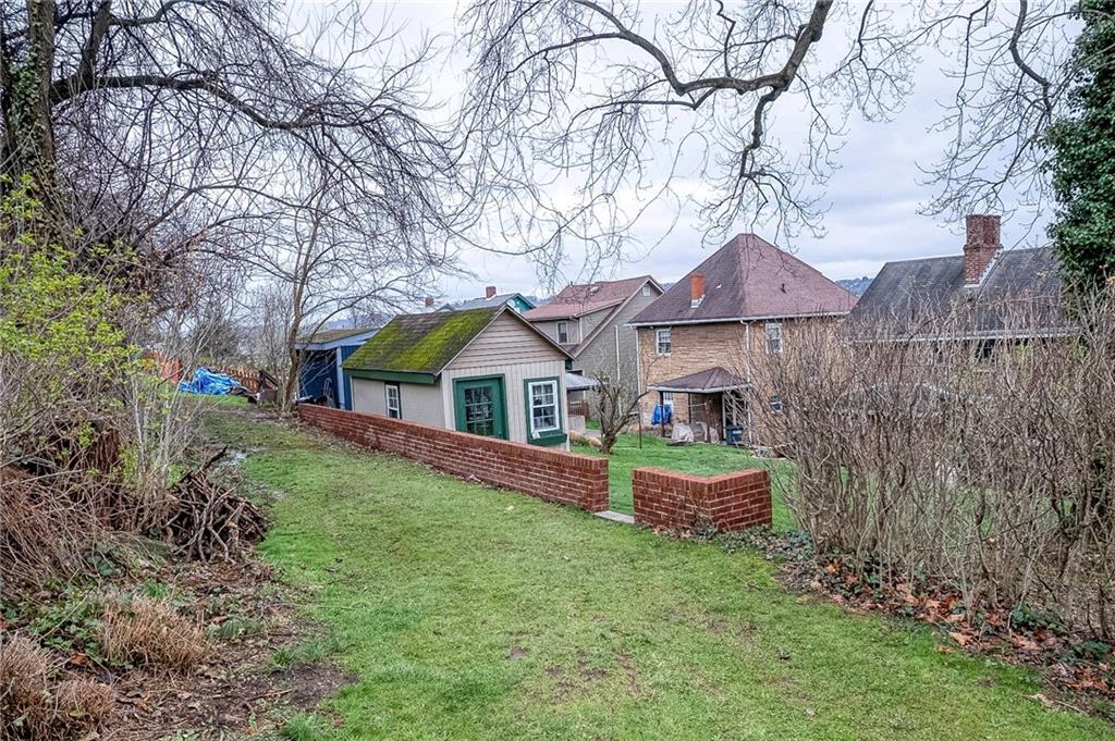 451 Walnut Street Pittsburgh, PA 15238 - Photo 37 of 40 a front view of a house with a garden and yard