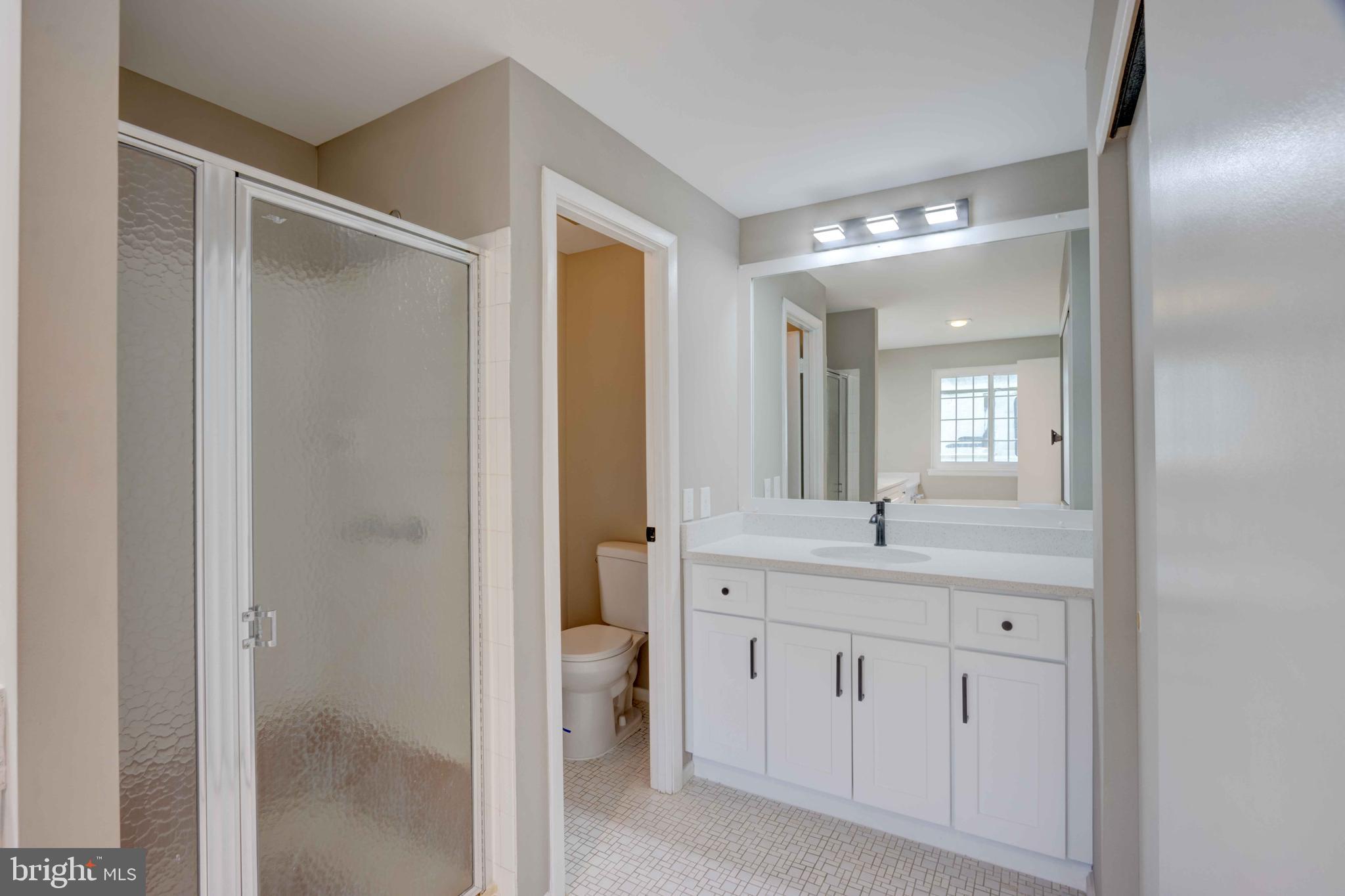 11859 Blue February Way Columbia, MD 21044 - Photo 16 of 35 a bathroom with a granite countertop sink mirror and double
