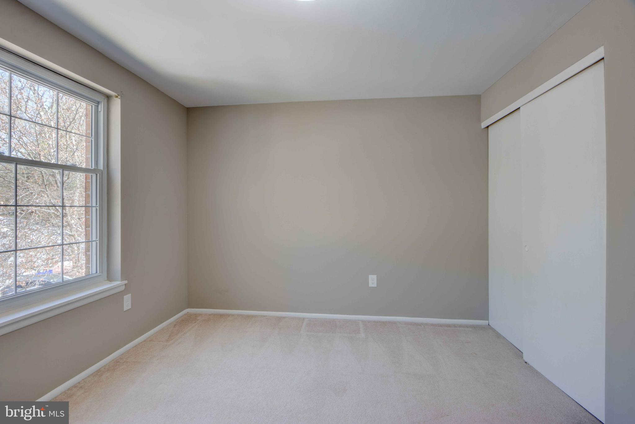 11859 Blue February Way Columbia, MD 21044 - Photo 24 of 35 an empty room with a empty space and windows