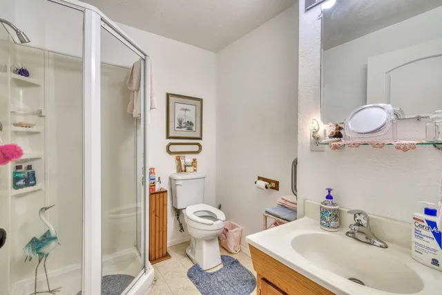 a bathroom with a sink vanity and mirror
