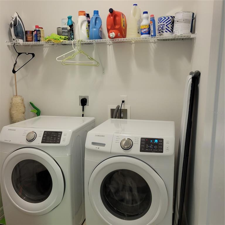 152 Navigation Circle, Unit 107 Osprey, FL 34229 - Photo 18 of 25 a utility room with dryer and washer