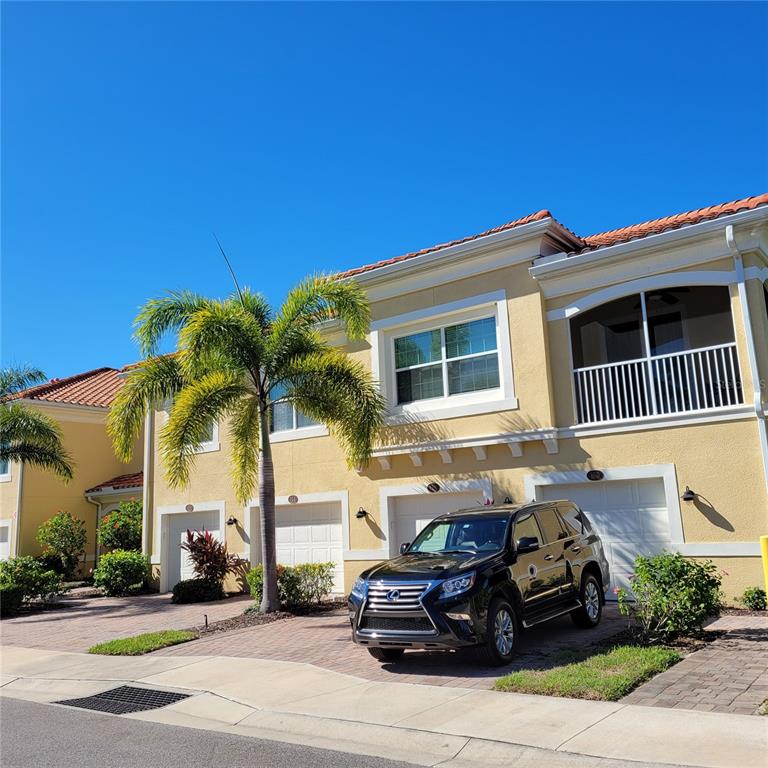 152 Navigation Circle, Unit 107 Osprey, FL 34229 - Photo 2 of 25 a car parked in front of a house