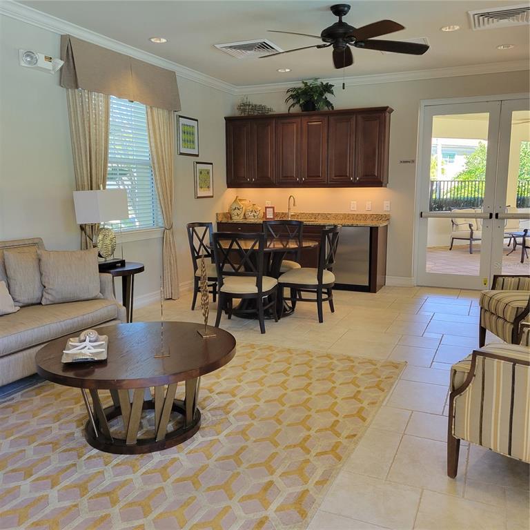 152 Navigation Circle, Unit 107 Osprey, FL 34229 - Photo 21 of 25 a living room with furniture and wooden floor