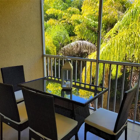 a view of a balcony with chairs