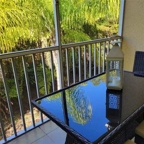 a view of a two chairs in the balcony
