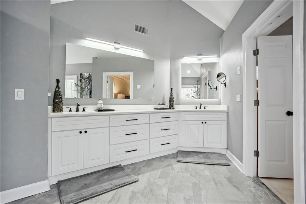 12480 Magnolia Circle Alpharetta, GA 30005 - Photo 14 of 19 a spacious bathroom with a double vanity sink mirror and