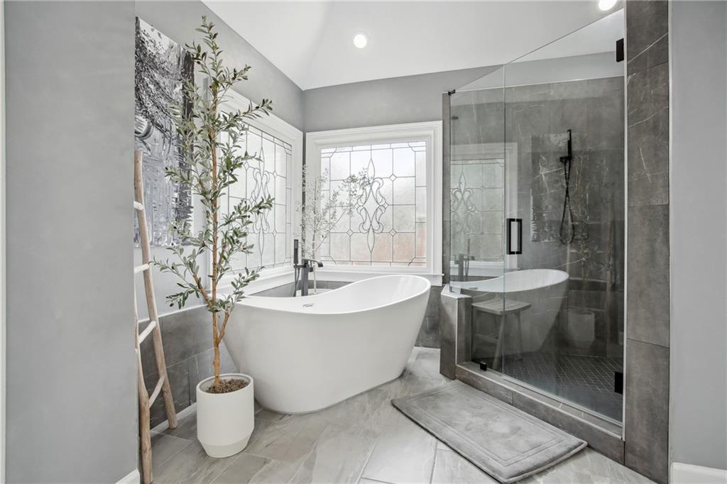 12480 Magnolia Circle Alpharetta, GA 30005 - Photo 15 of 19 a spacious bathroom with a sink and mirror