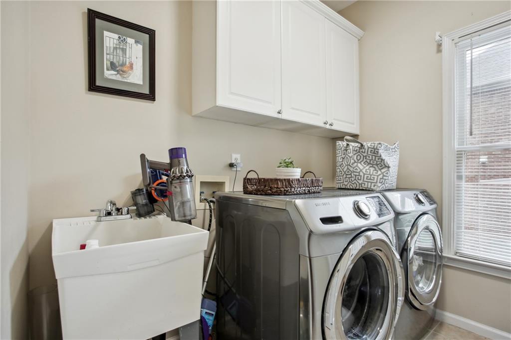 12480 Magnolia Circle Alpharetta, GA 30005 - Photo 19 of 19 a utility room with dryer and washer