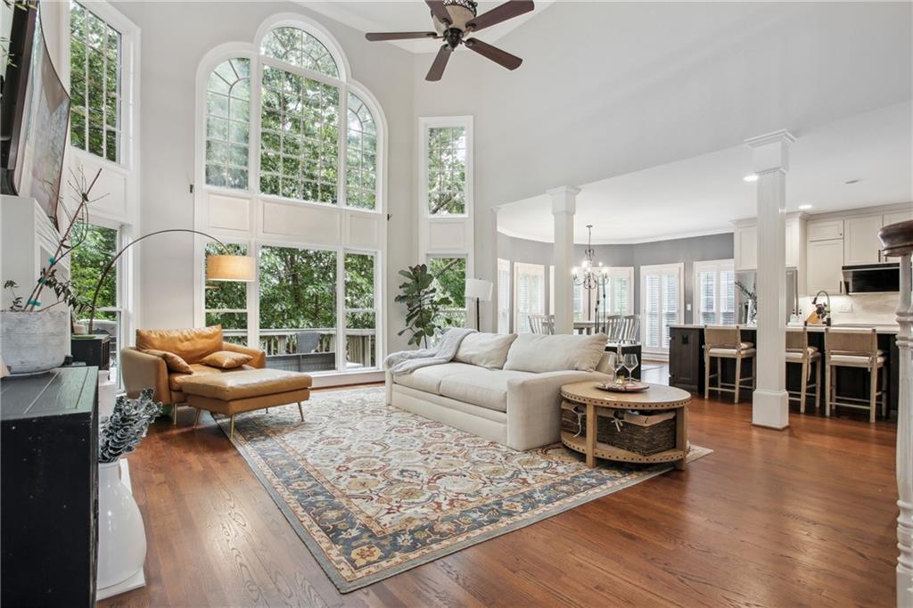 12480 Magnolia Circle Alpharetta, GA 30005 - Photo 5 of 19 a living room with furniture fireplace and a large window