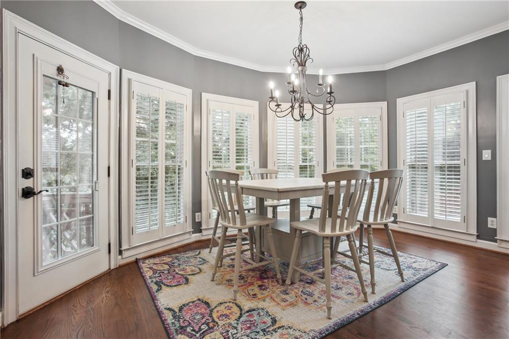 12480 Magnolia Circle Alpharetta, GA 30005 - Photo 10 of 19 a view of a dining room with furniture window and wooden floor