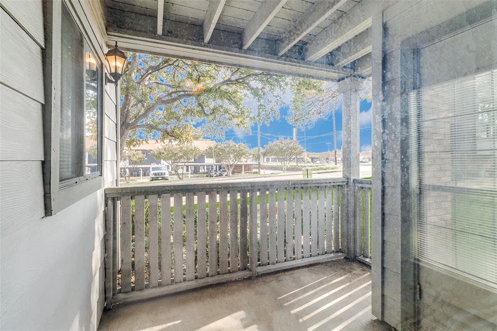 15151 Berry Trail, Unit 407 Dallas, TX 75248 - Photo 13 of 16 a view of a balcony with wooden floor