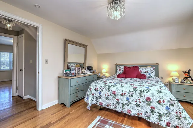 a bedroom with a bed and a television