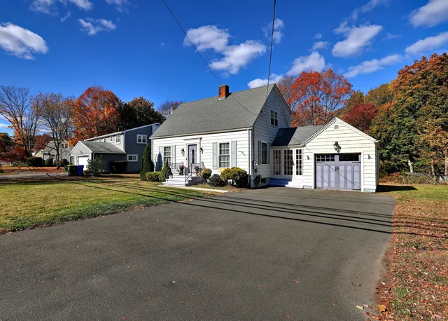 a view of a backyard with swimming pool