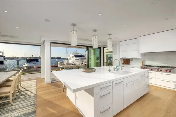 a large bathroom with a double vanity sink a mirror and a bathtub
