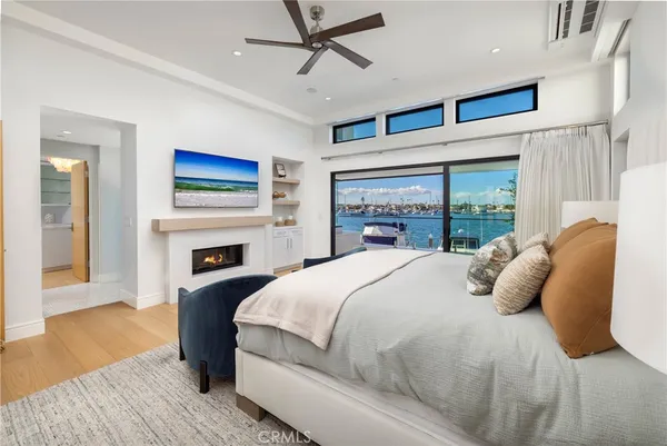 a large white bed in a white room