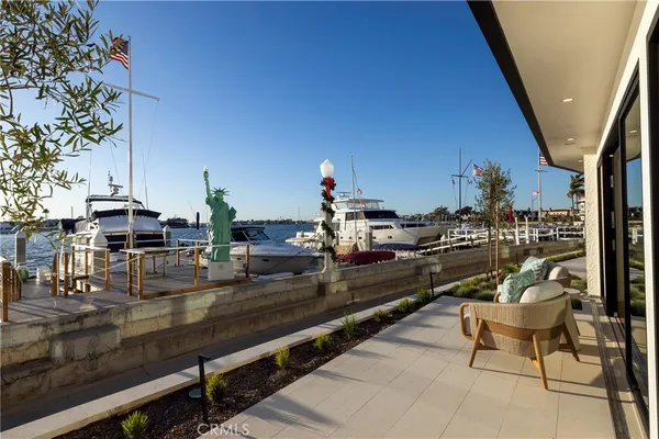 a terrace with outdoor seating and living room view