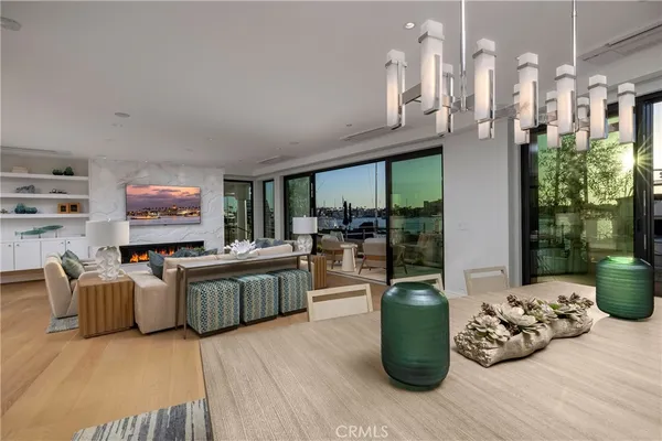 a kitchen with a table chairs and wooden floor