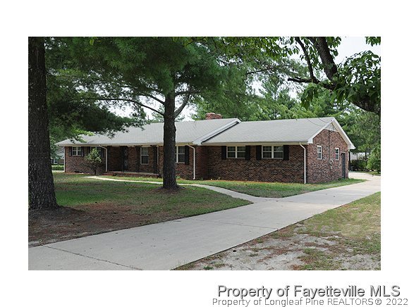 5322 Lakeview Road Hope Mills, NC 28348 - Photo 1 of 23 a house view with a garden space