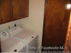 5322 Lakeview Road Hope Mills, NC 28348 - Photo 14 of 23 a utility room with dryer and washer