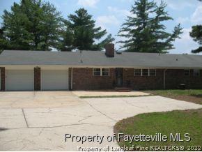 5322 Lakeview Road Hope Mills, NC 28348 - Photo 22 of 23 a front view of a house with a yard