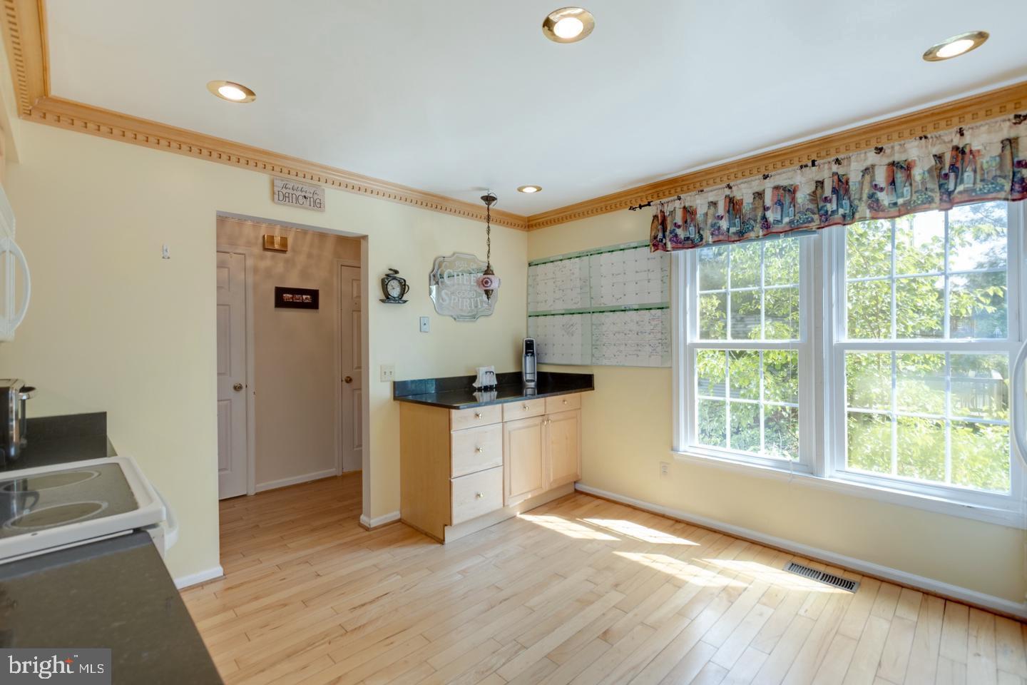 8601 Raglan Road Vienna, VA 22182 - Photo 6 of 47 Bright and airy kitchen with sunny views.
