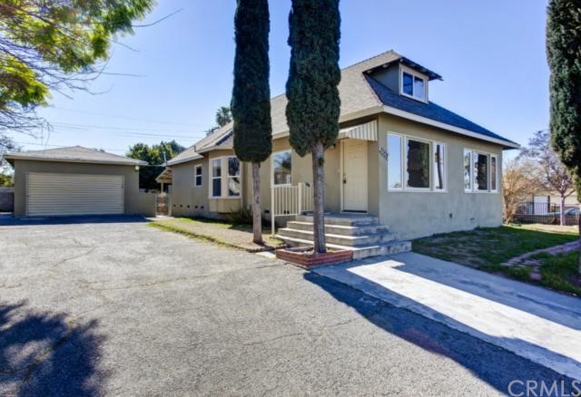2008 3rd Street Riverside, CA 92507 - Photo 1 of 1 a front view of a house with a yard and garage
