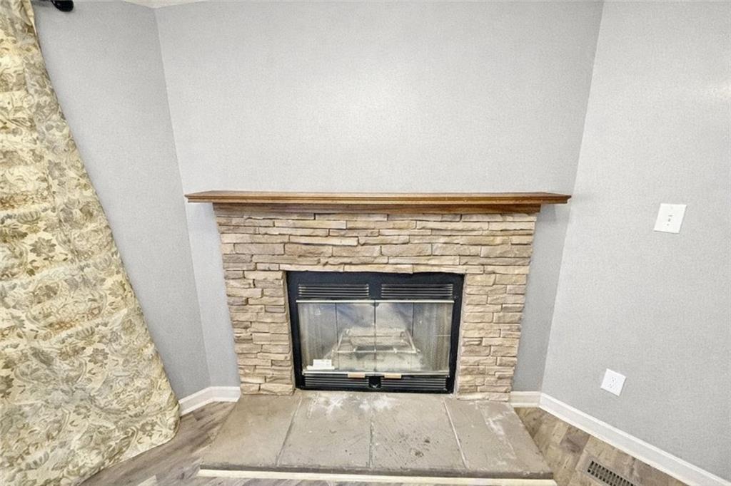 460 Cherokee Trail Ball Ground, GA 30107 - Photo 5 of 23 a living room with a fireplace