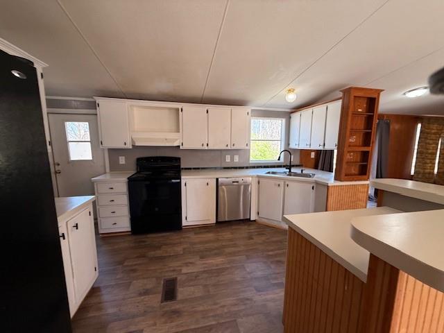 460 Cherokee Trail Ball Ground, GA 30107 - Photo 7 of 23 a kitchen with stainless steel appliances granite countertop a stove top oven a sink a refrigerator white cabinets and wooden floor