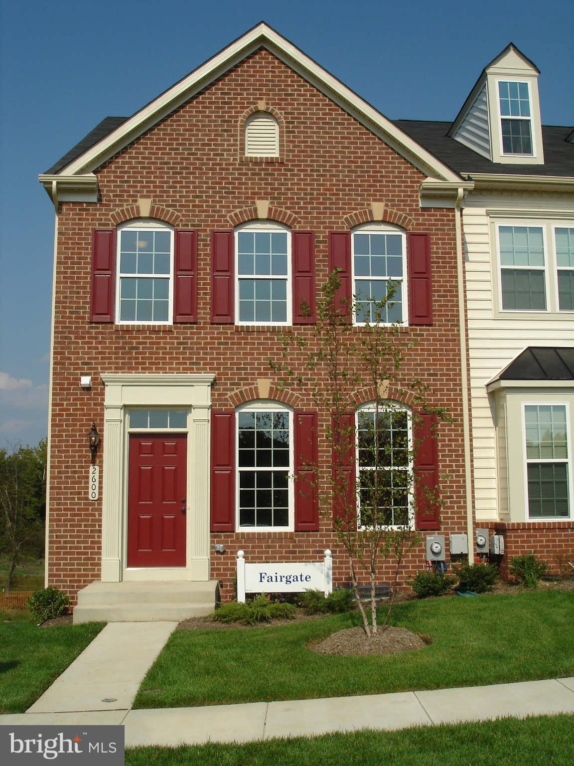2414 Baileys Pond Road Accokeek, MD 20607 - Photo 1 of 22 a front view of a house with a yard