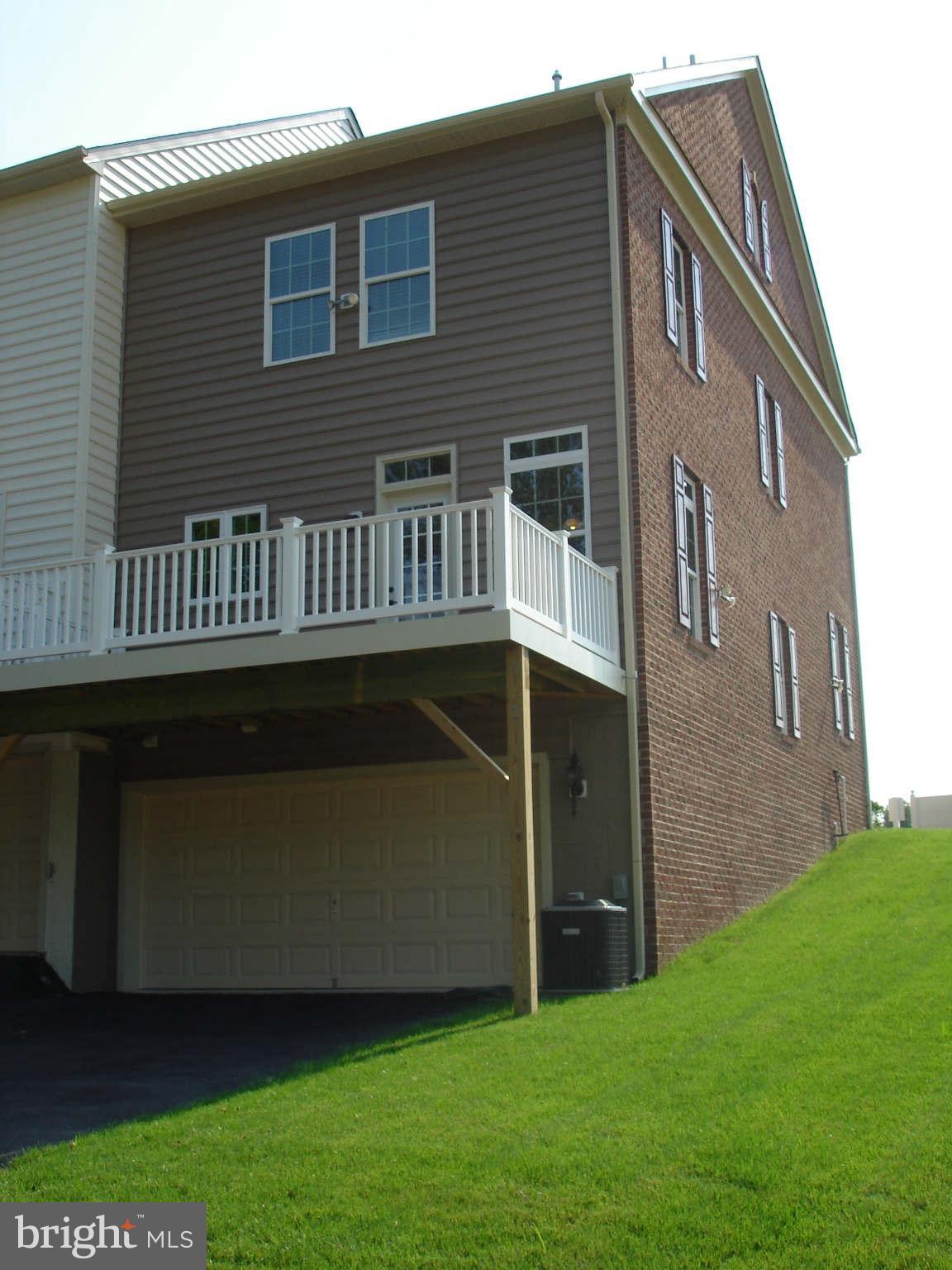 2414 Baileys Pond Road Accokeek, MD 20607 - Photo 13 of 22 a view of backyard with deck