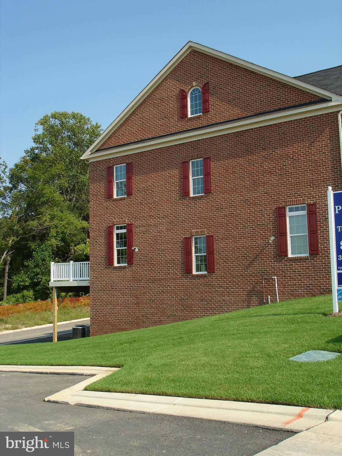 2414 Baileys Pond Road Accokeek, MD 20607 - Photo 14 of 22 a front view of a house with a yard