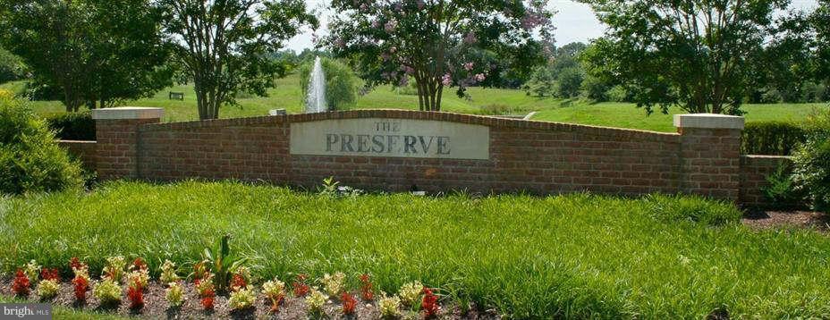 2414 Baileys Pond Road Accokeek, MD 20607 - Photo 7 of 22 a sign on the side of a building