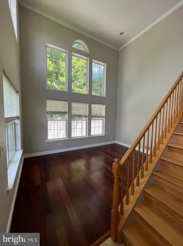 a view of an entryway with wooden floor