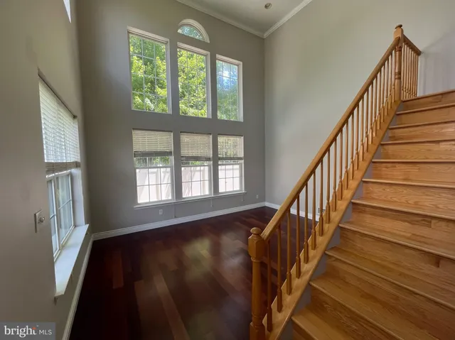 a view of an entryway with wooden floor