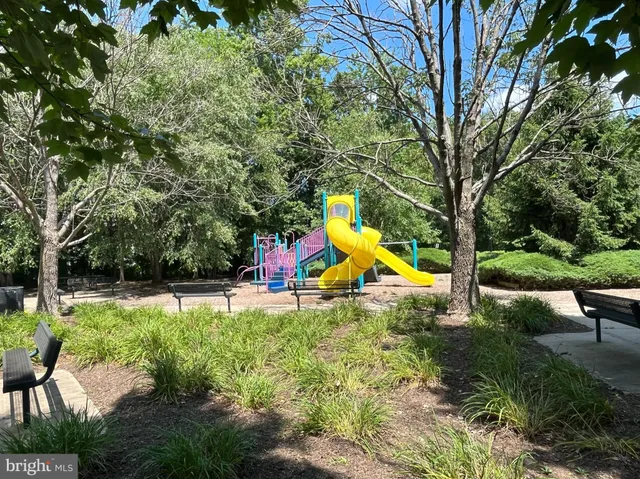 a view of a backyard with swimming pool