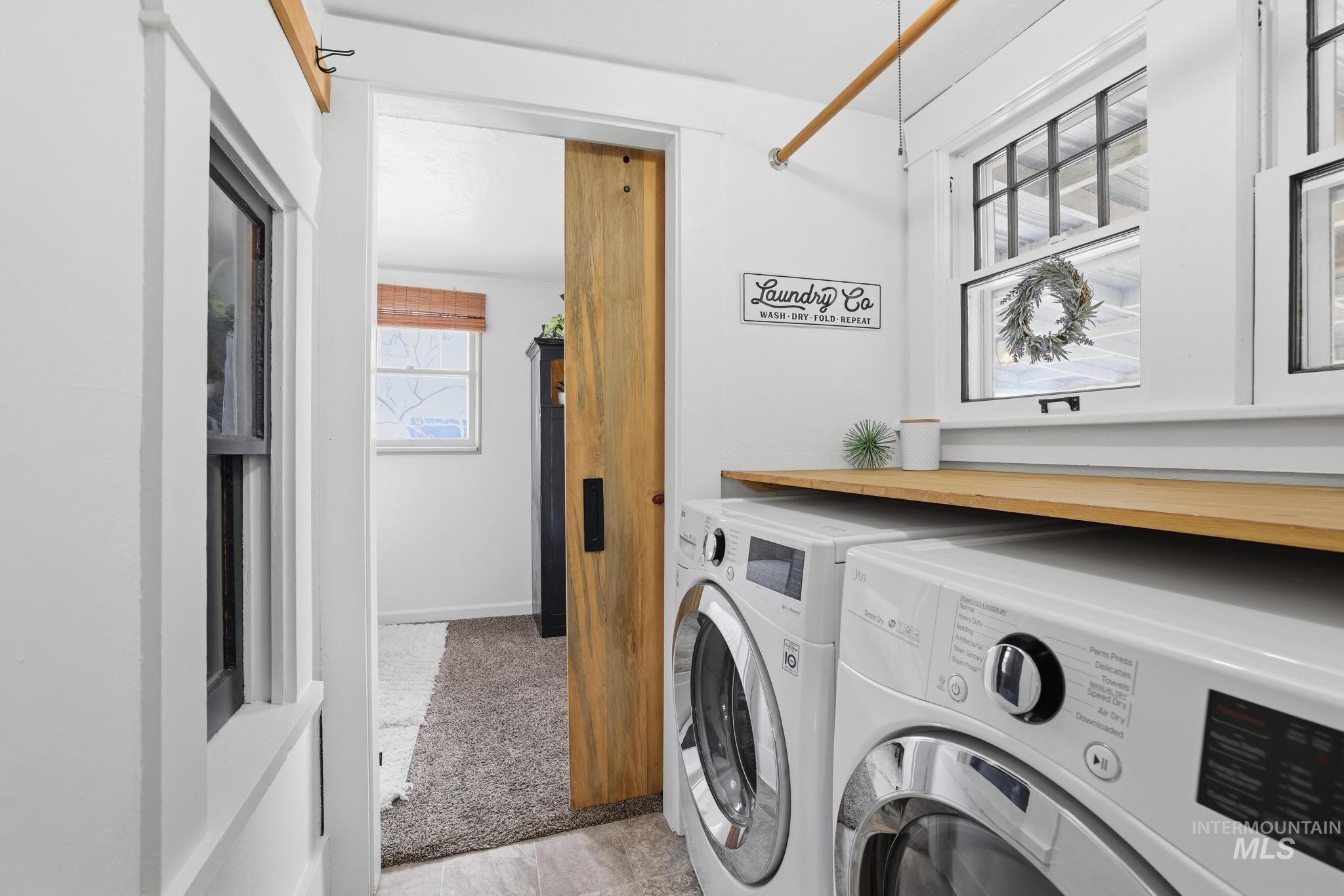 502 6th Street Filer, ID 83328 - Photo 19 of 41 Laundry area with independent washer and dryer and light colored carpet