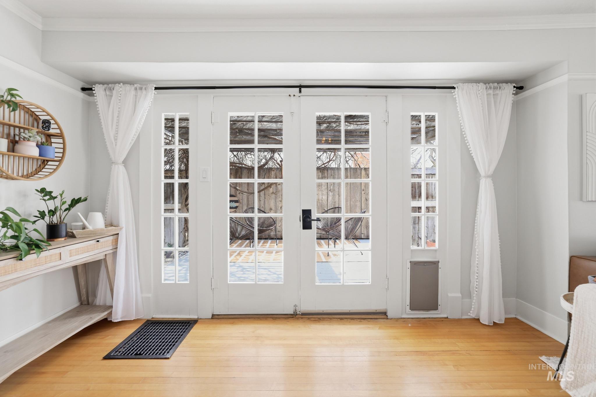 502 6th Street Filer, ID 83328 - Photo 23 of 41 Doorway featuring crown molding and hardwood / wood-style floors