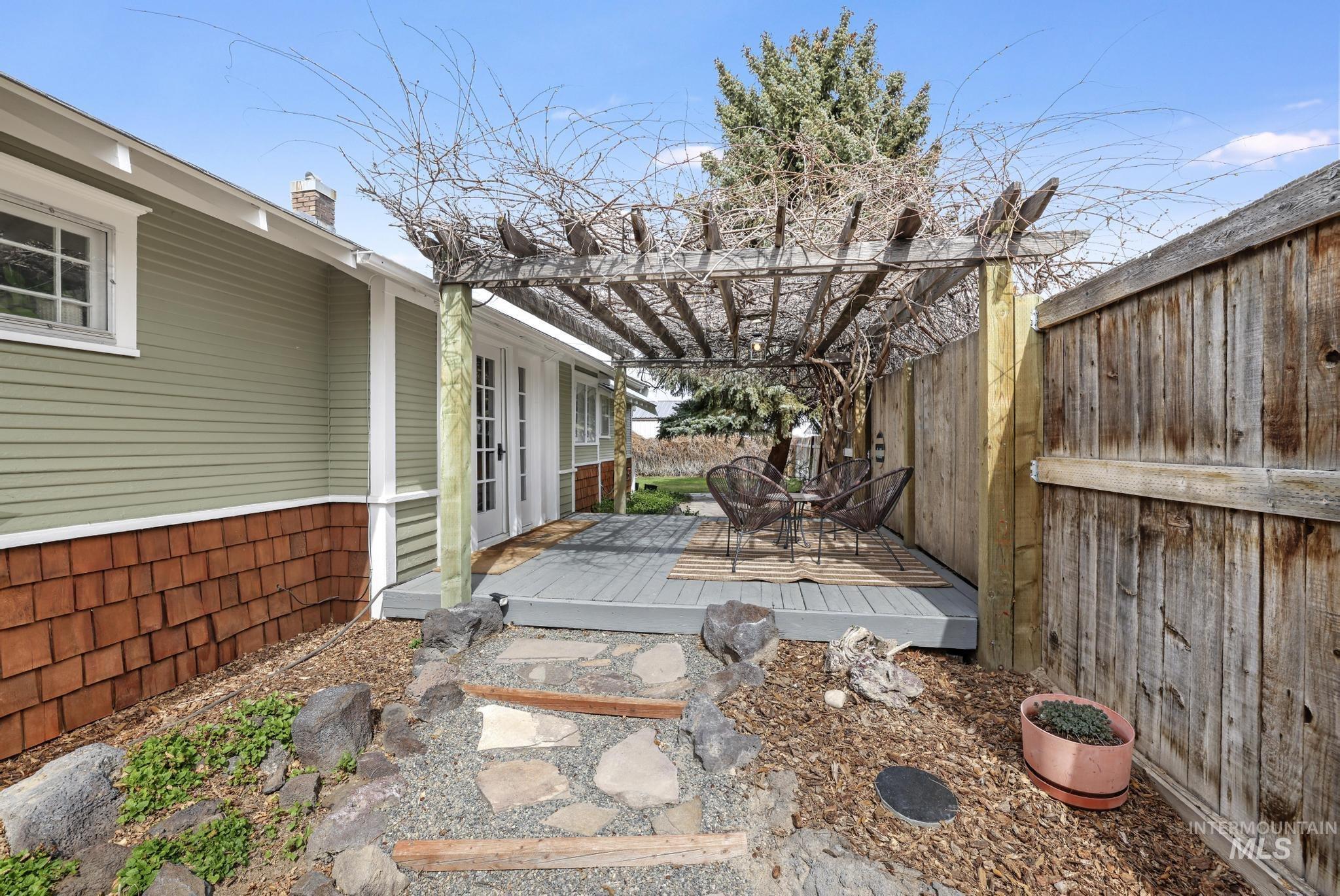 502 6th Street Filer, ID 83328 - Photo 24 of 41 View of patio / terrace with a deck, a pergola, and french doors