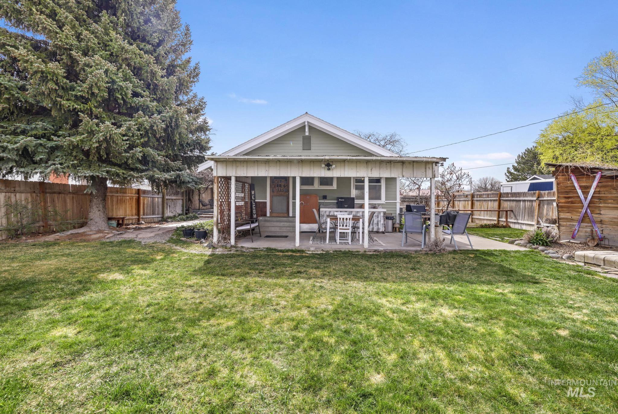 502 6th Street Filer, ID 83328 - Photo 30 of 41 Back of house featuring a patio area and a fenced backyard